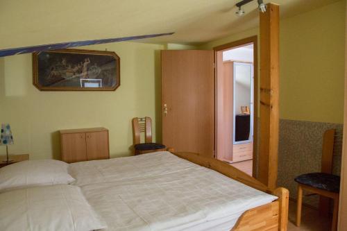 a bedroom with a large bed in a room at Apartment der Villa Elsa in Dresden