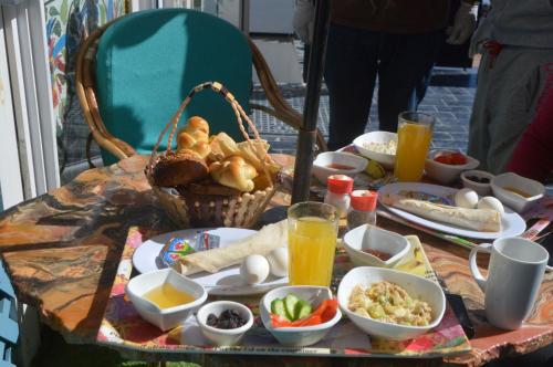 a table with breakfast foods and drinks on it at Skyrock Dahab in Dahab