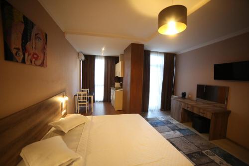 Postel nebo postele na pokoji v ubytování Hotel Soft