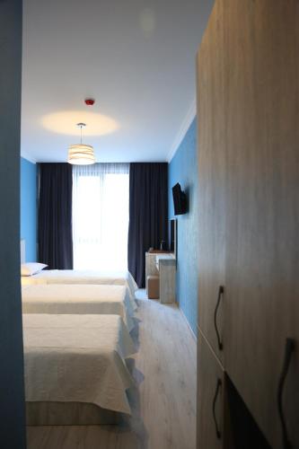 Postel nebo postele na pokoji v ubytování Hotel Soft