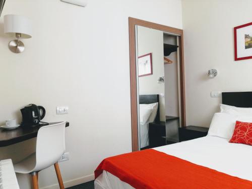 Postel nebo postele na pokoji v ubytování Hotel Arcos