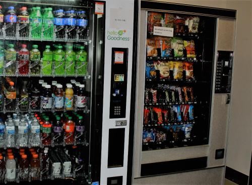 two soda vending machines with drinks and drinks at Microtel Inn by Wyndham Atlanta Airport in Atlanta