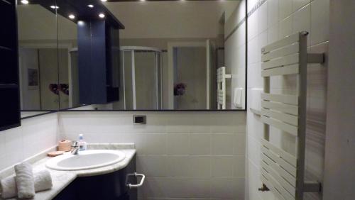 a bathroom with a sink and a mirror at House Giorgia by Holiday World in Santa Margherita Ligure