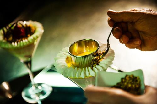 a person is eating food from a spoon at Grande Albergo Miramare in Formia