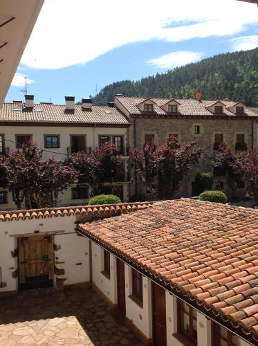 a view of a building with a tile roof at Apartamentos Turísticos Rincones del Vino in Ezcaray