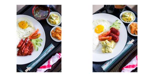 two plates of breakfast food on a table at Minshuku KCS Hotel and Restaurant in Puerto Galera