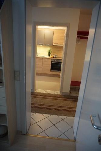 a view of a kitchen through a doorway at Apartment Regina in Burgberg