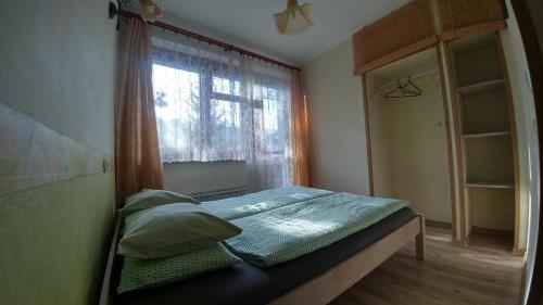 מיטה או מיטות בחדר ב-Pod Klimczokiem I