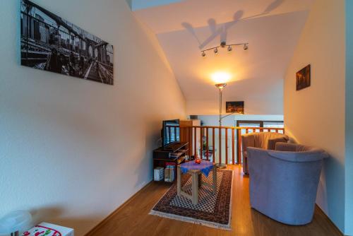 a living room with a couch and a table at Moseltalblick in Bernkastel-Kues