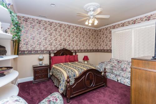 a bedroom with a bed and a couch at Whiskey Row Penthouse in Prescott