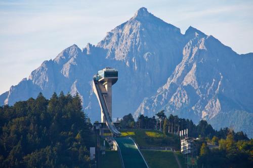 a hill with a mountain in the background at Hotel Gasthof Stefansbrücke in Innsbruck