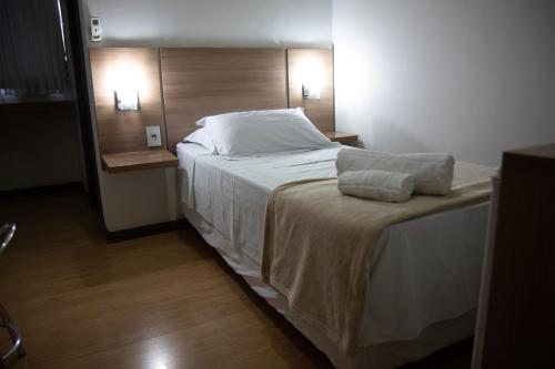 Ένα ή περισσότερα κρεβάτια σε δωμάτιο στο Maximus Business Hotel
