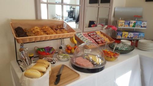 a table with a bunch of food on it at The Burlington Hotel in Cleethorpes