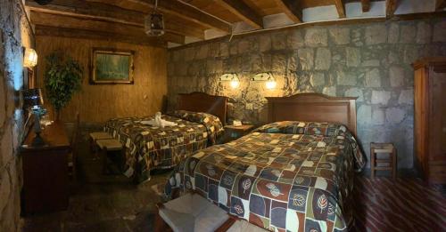 Ένα ή περισσότερα κρεβάτια σε δωμάτιο στο Hotel Casa del Anticuario