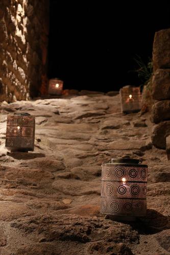 two boxes sitting on a stone ground at night at Domaine des hauts de Vernon in Vernon