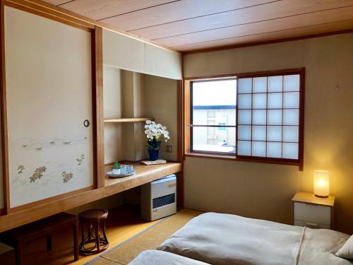 Cama o camas de una habitación en Akakura Akarien