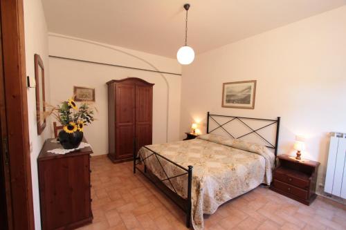 Katil atau katil-katil dalam bilik di Agriturismo Montegonfoli