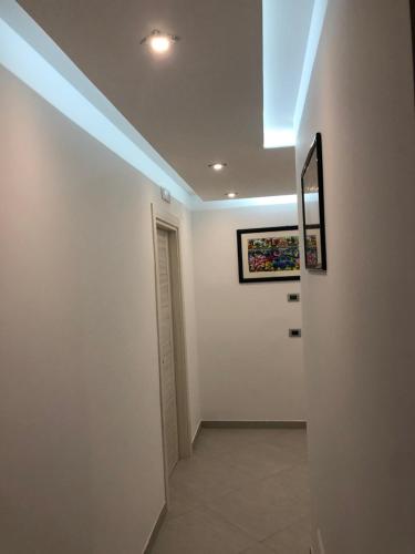 a hallway with a skylight on the ceiling at B&B Rossini Luxury in Rende