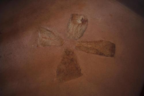 a cross tattoo on the stomach of a person at Antico Trullo Salentino in Salve
