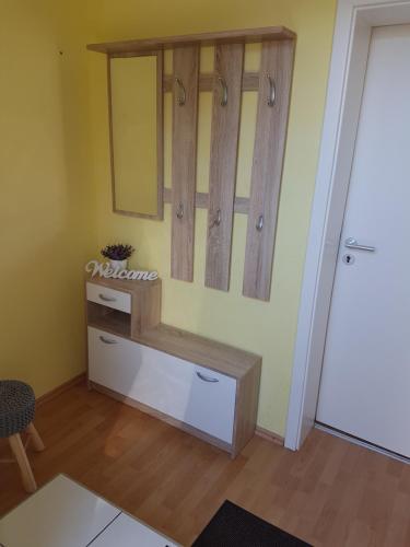 a room with a dressing table and a mirror on the wall at Altstadtflair in Wernigerode