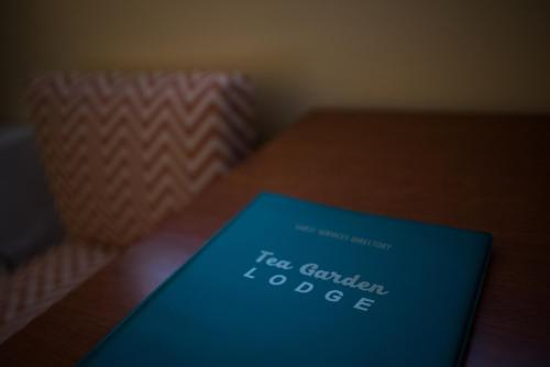 a book sitting on top of a wooden table at Tea Garden Lodge in South Lake Tahoe