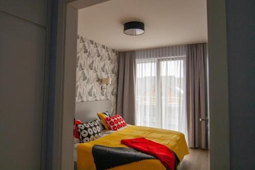 מיטה או מיטות בחדר ב-Apartament 21 Czarna Góra