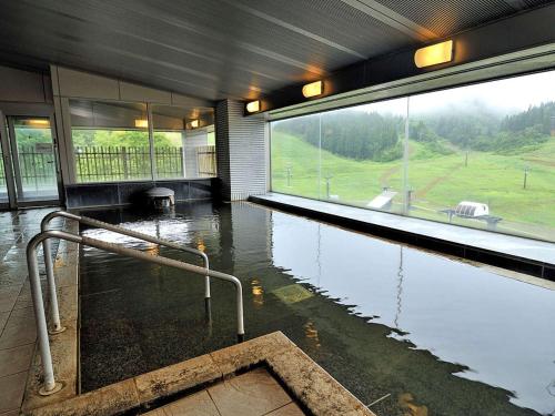 a flooded room with a pool of water in a building at New Greenpia Tsunan in Tsunan