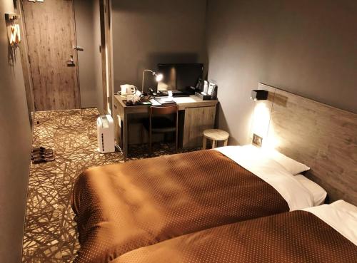 Кровать или кровати в номере Hotel Nakamuraya