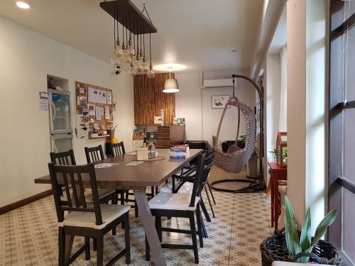 a dining room with a table and chairs at Cooper in Bangkok