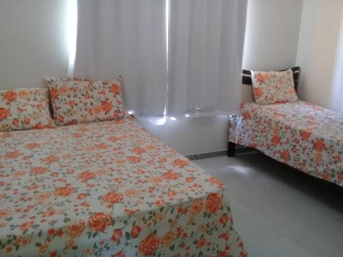 Ένα ή περισσότερα κρεβάτια σε δωμάτιο στο Condomínio Resort Villa das Águas