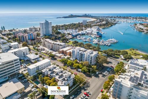 an aerial view of a city with a marina at Dockside Apartments Mooloolaba in Mooloolaba