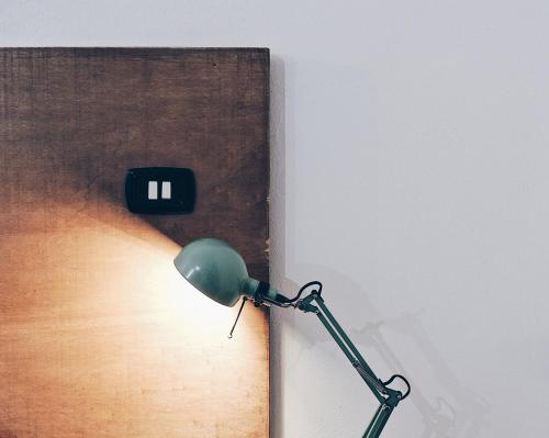 a light plugged into a wall next to a lightswitch at Casa Anna in Ilbono