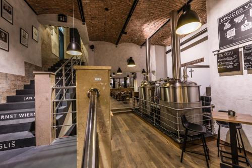 a tasting room with a bunch of pots and pans at Apartmánový dům U Tomana in Brno