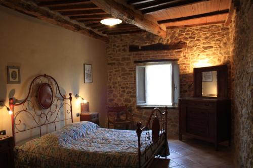 A bed or beds in a room at Agriturismo Materno