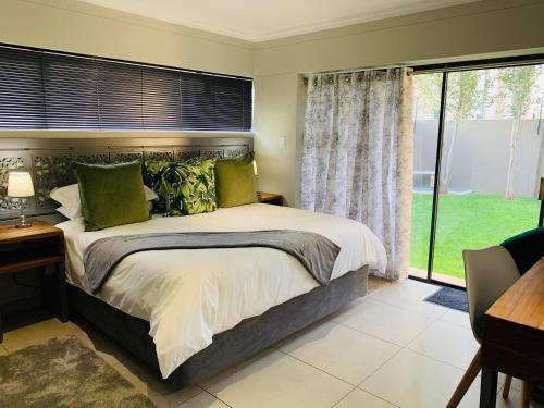 Katil atau katil-katil dalam bilik di Welgemeendt Accommodation