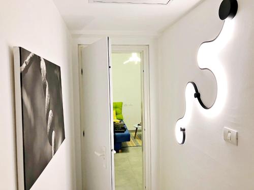 a hallway with a mirror and a door to a room at Amazing sea View, steps to beach, near Tel-aviv in Bat Yam