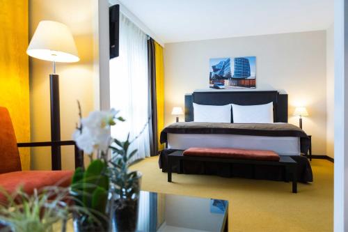 Giường trong phòng chung tại Hotel Euler Basel