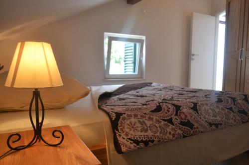 Postel nebo postele na pokoji v ubytování Apartments Toni Sea view