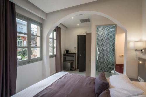 a bedroom with a bed and a window at Cretan Berry Portou in Chania Town