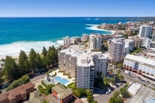 an aerial view of a city and the ocean at Quest Cronulla Beach in Cronulla
