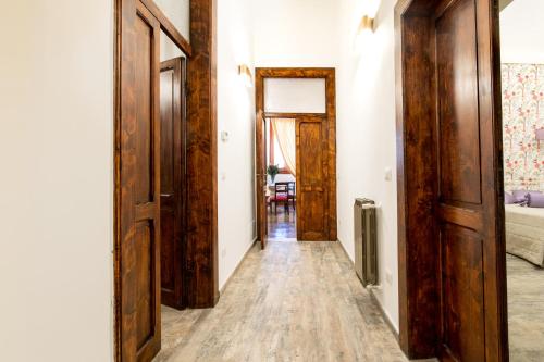 an open hallway with wooden doors and a room at Residenza Carlandi Tivoli in Tivoli
