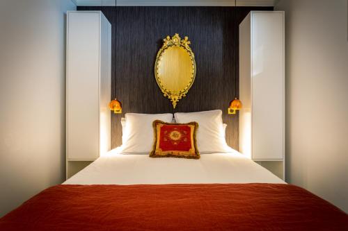 Postelja oz. postelje v sobi nastanitve L'Appartement des Roches