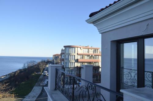 a balcony of a building with a view of the ocean at Ashram Hotel in Primorsko