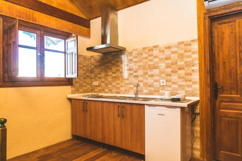 a kitchen with a sink and a window at Camping Fort Bravo in Tabernas