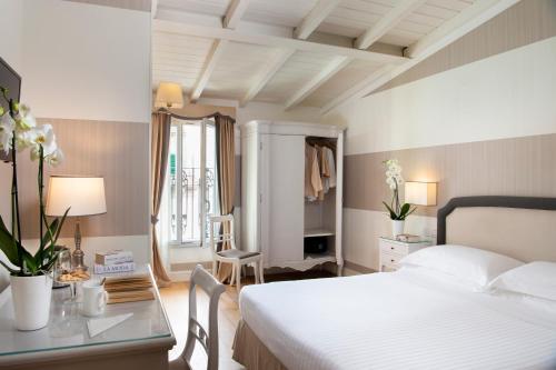 Voodi või voodid majutusasutuse Hotel Rapallo toas