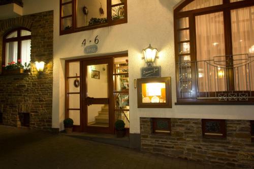 a facade of a building with a door and windows at Winzerhof Brachtendorf in Alken