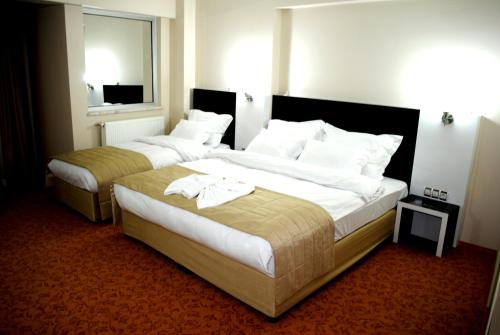 Cama ou camas em um quarto em Anya Suit Otel