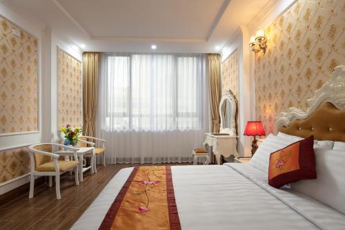 Ένα ή περισσότερα κρεβάτια σε δωμάτιο στο Busan Hotel