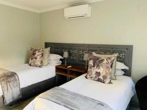 Katil atau katil-katil dalam bilik di Welgemeendt Accommodation