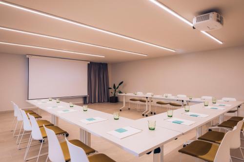 a conference room with a long table and chairs at Iberostar Selection Llaut Palma- Adults Only in Playa de Palma